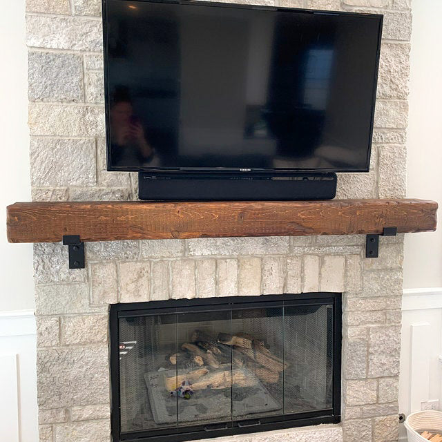 TV mounted above fireplace
