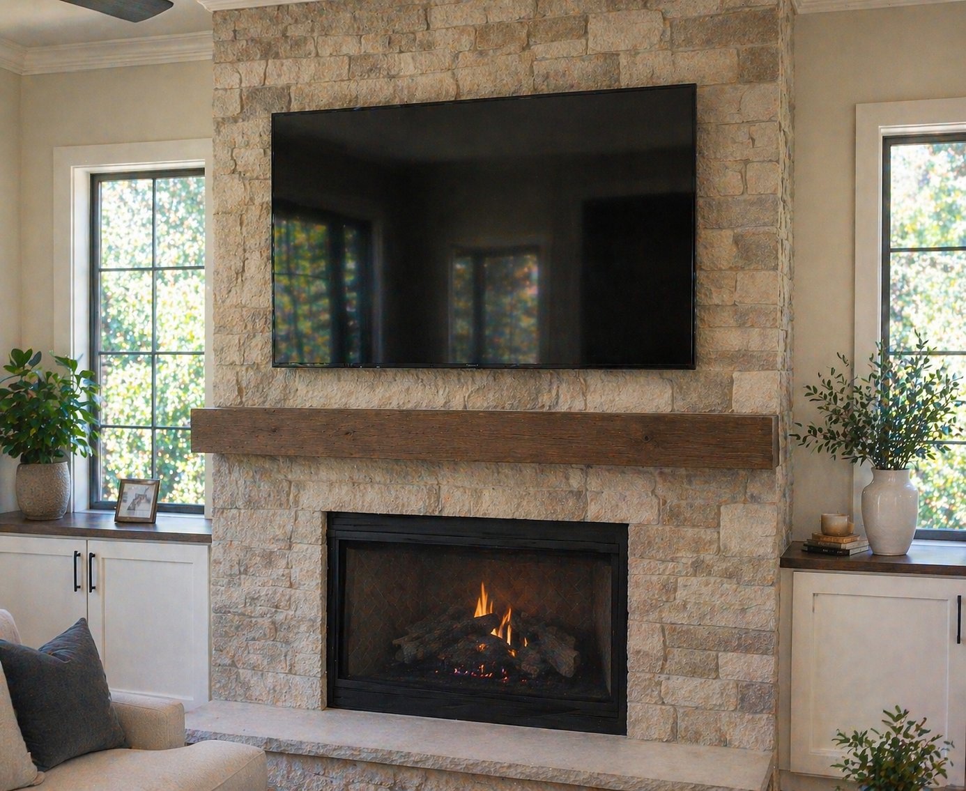 TV above stone fireplace